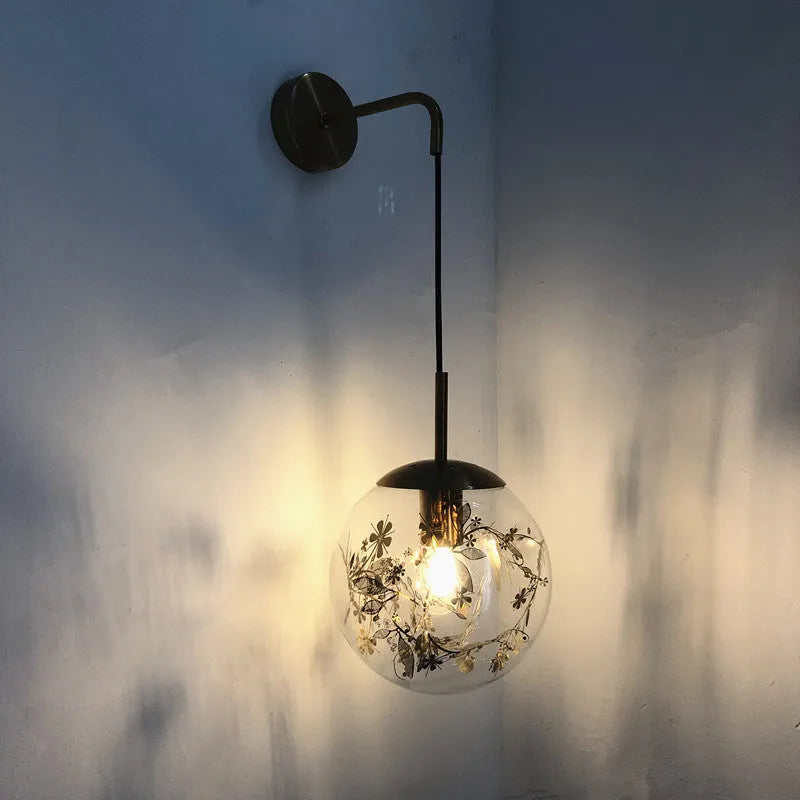 Modern glass wall-mounted bedside lamp in gold or silver finish, shown in 15cm and 20cm size options.