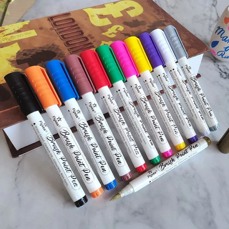 Set of soft head gouache acrylic marker pens for hand painting and card design.