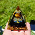 6cm tall epoxy resin pyramid ornament with embedded natural crystal gravel particles