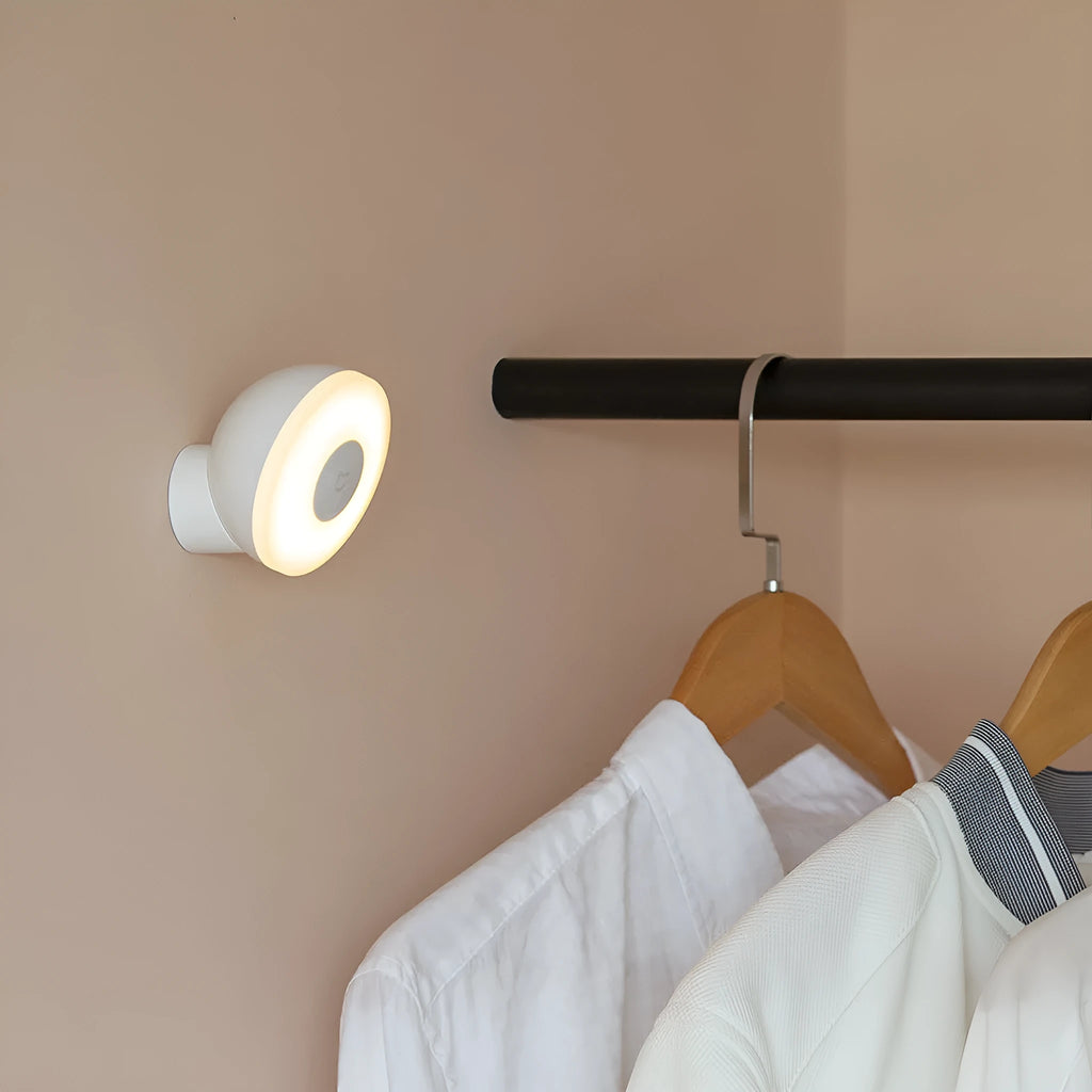 White Mijia Night Light 2 Bluetooth bedside lamp with human body induction on wooden table