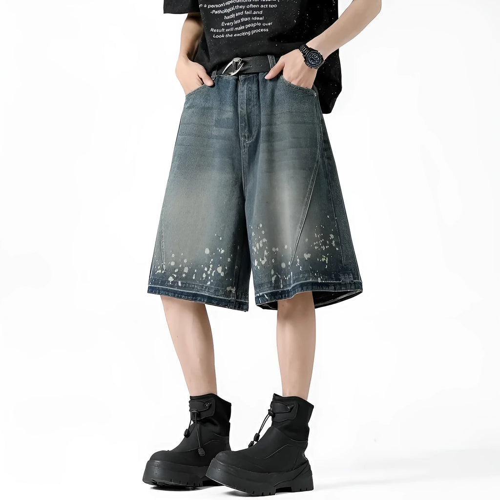 Men's retro blue denim shorts with ripped details and splash ink pattern