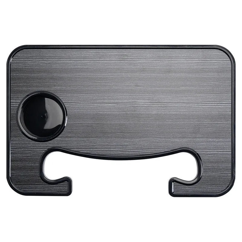 Foldable black car laptop stand with integrated drink holder placed on steering wheel