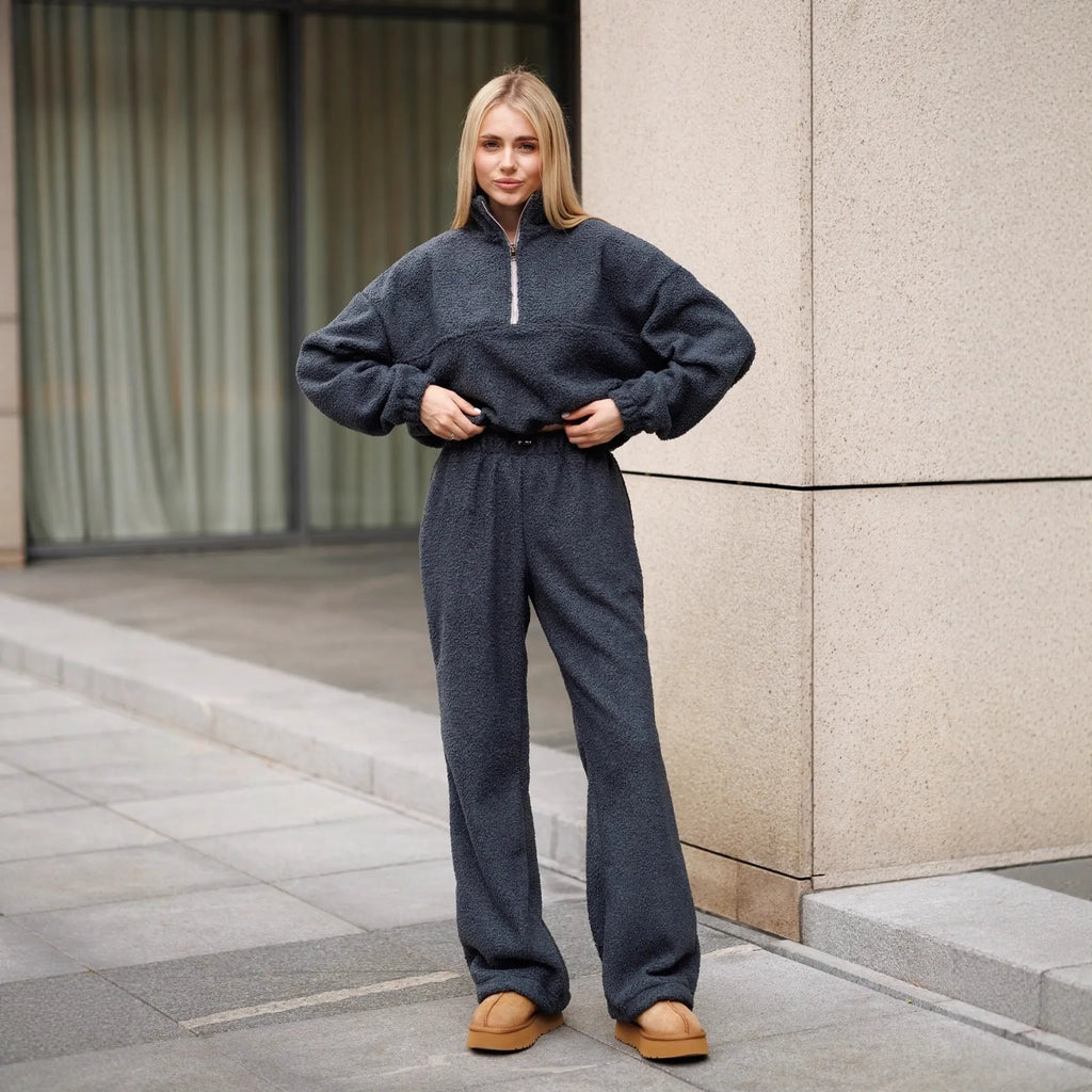 Polar fleece two-piece suit with long sleeve half pull top and trousers in solid grey or white, sizes S M L.