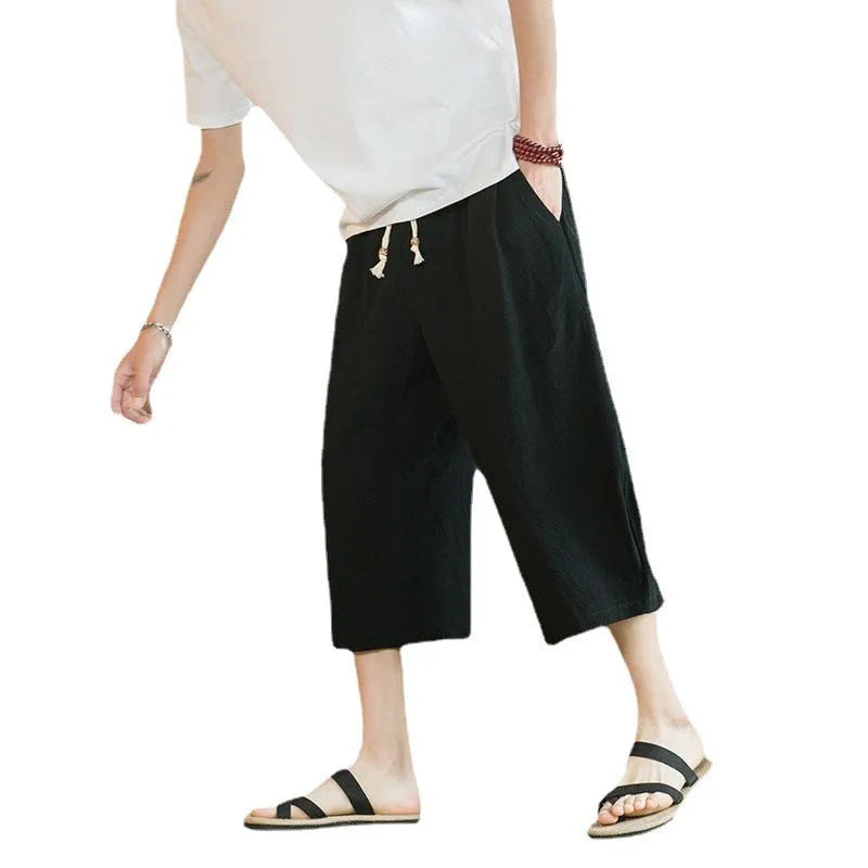 Straight leg linen shorts in khaki colour with skinny ankle opening on plus-size model