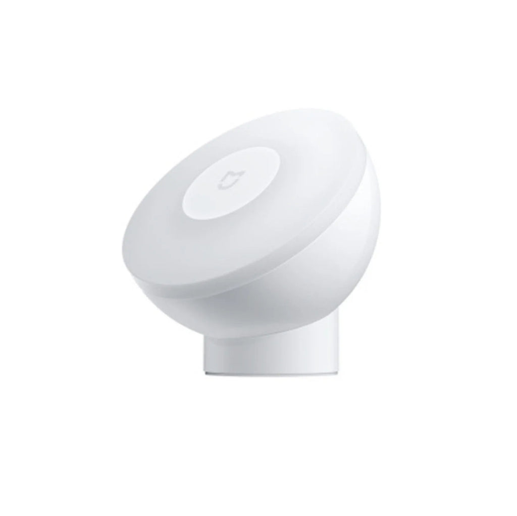 White Mijia Night Light 2 Bluetooth bedside lamp with human body induction on wooden table