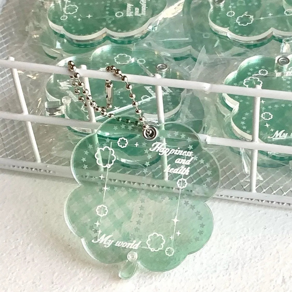 Acrylic four-leaf clover mobile phone pendant charm in blue, green, or mint colour options