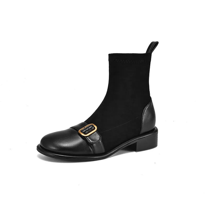 Women's black casual Martin ankle boots with belt buckle stitching and white laces on a rubber sole.