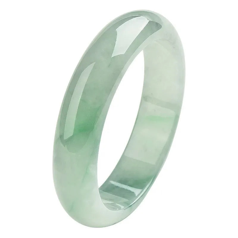 Light green jade bracelet showing natural stone texture on wrist