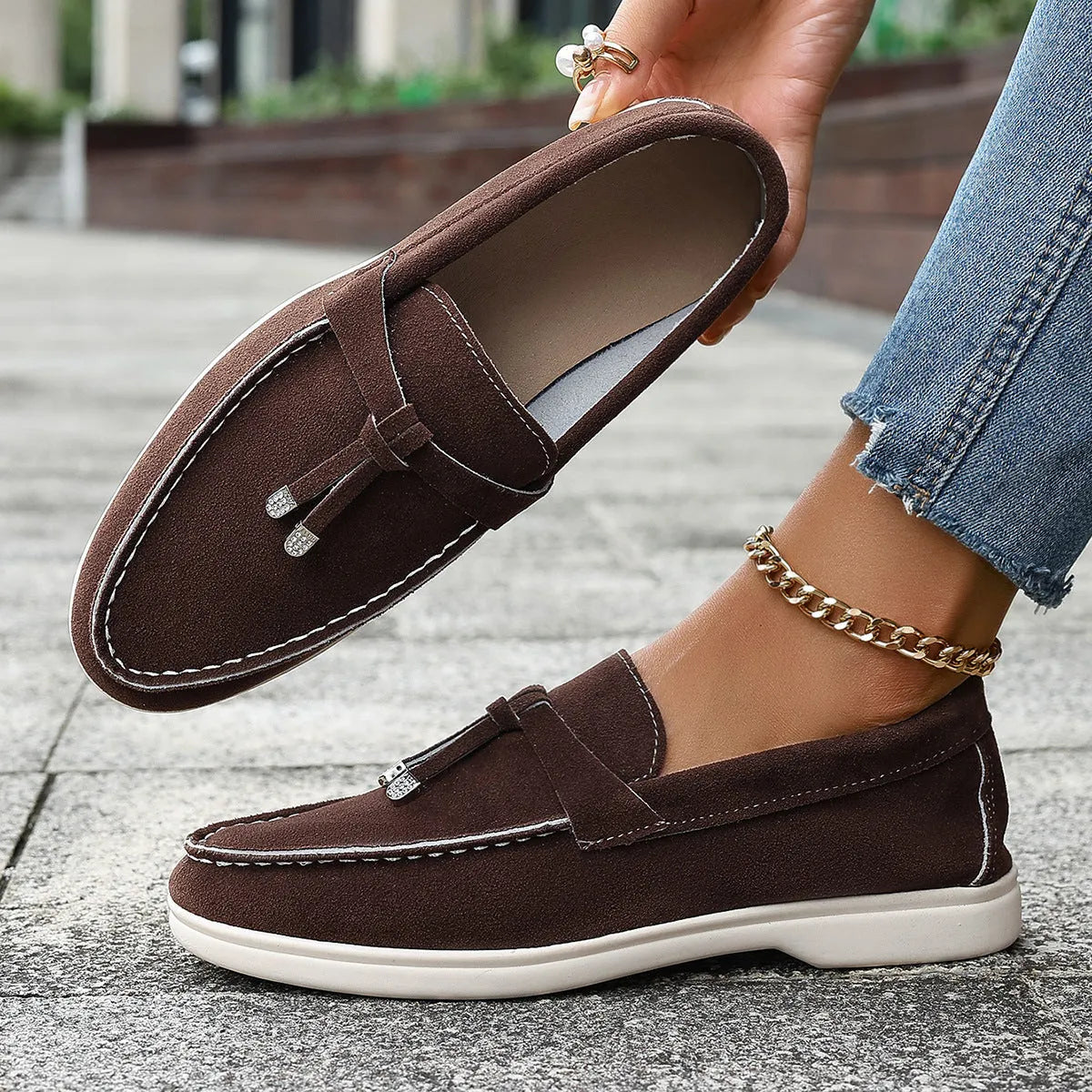 Canvas slip-on loafers in brown with round toe, rubber sole, and platform heel.
