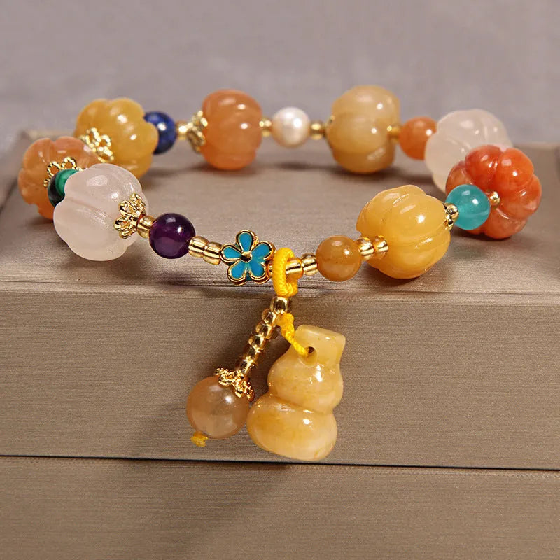 Women's multi-layer crystal bracelet with Korean design featuring natural garnet and assorted gemstone pendants