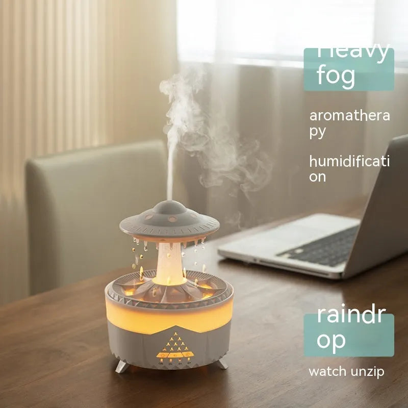 White UFO Raindrop Humidifier with 7-colour nightlight and essential oil diffuser on table