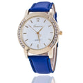 Geneva women's quartz watch with blue dial, round alloy case, and imitation leather strap on display