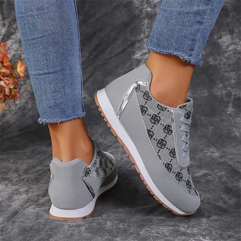 Flower print lace-up sneakers in camel with round toe and rubber sole