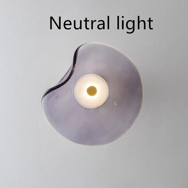 Round decorative wall lamp with glass shade in cognac colour for bedroom bedside lighting