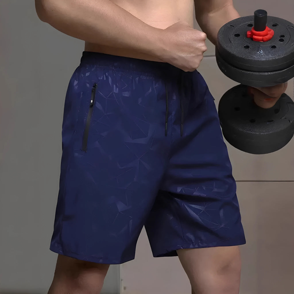 Men's loose fit sports shorts in polyester fabric with elastic waistband available in black, grey, and blue colours
