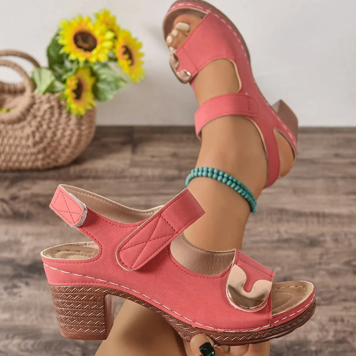 Light brown Velcro Roman sandals with adjustable straps on a rubber sole.