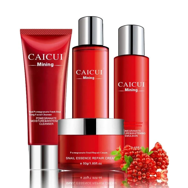 Pomegranate skincare set with four red bottles: face wash, toner, lotion and facial cream