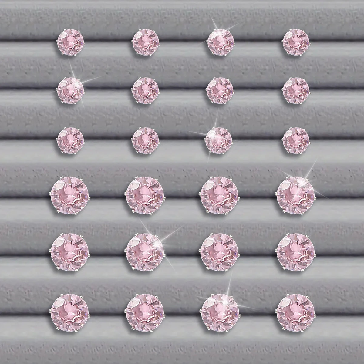 Pink round women's earrings set of 12 pairs on display, alloy with electroplated finish, geometric stud style