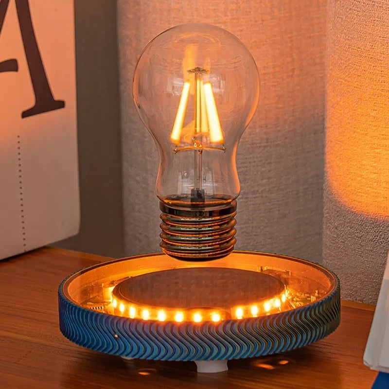 Magnetic suspension 3D printed moon night lamp on a desk with USB cable.