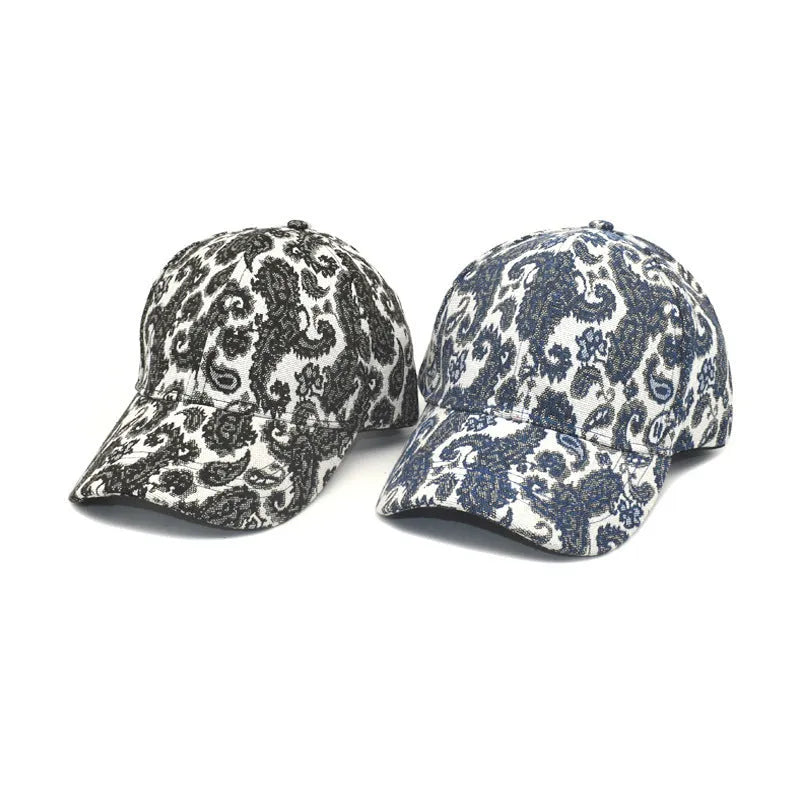 Blue polyester baseball cap with a white paisley pattern printed on the dome crown.