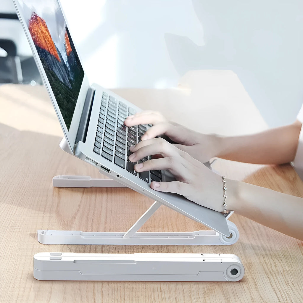 Black ABS folding laptop stand on desk with laptop placed on top
