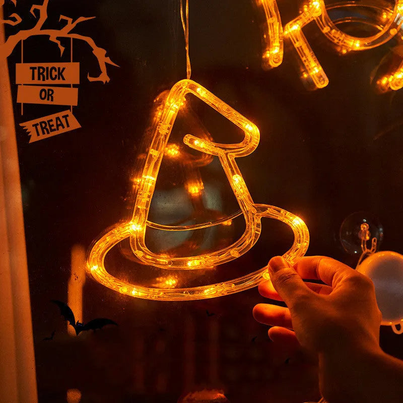 Halloween window hanging LED lights with spider and pumpkin decorations creating horror atmosphere lighting