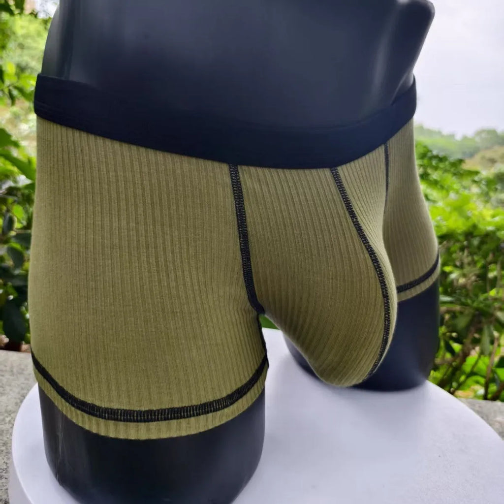 Men's solid colour breathable boxer shorts on a size chart showing weight ranges for L, XL, 2XL, and 3XL.