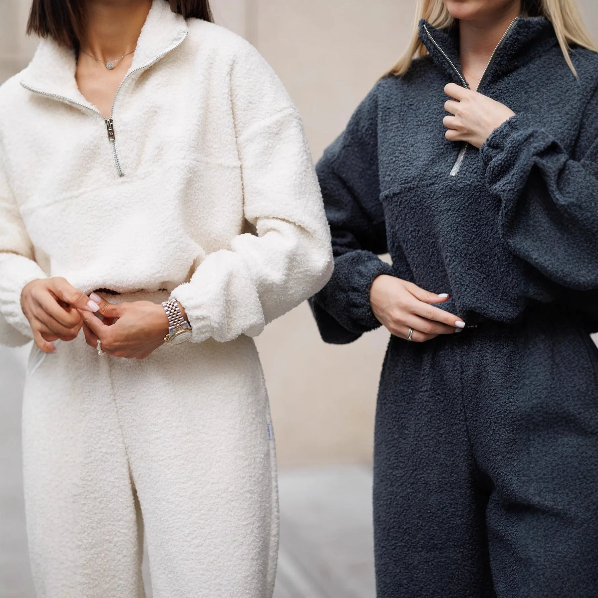 Polar fleece two-piece suit with long sleeve half pull top and trousers in solid grey or white, sizes S M L.