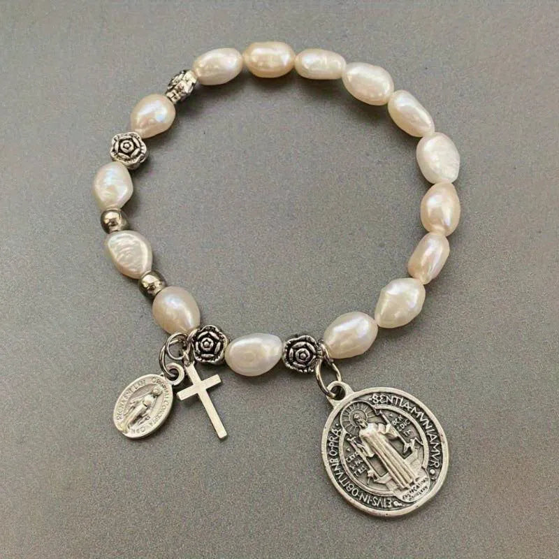 Silver beaded flower bracelet on display with metal links