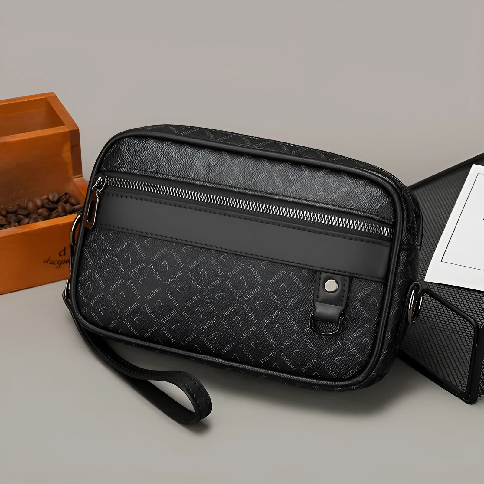 Men's black PU leather messenger bag with geometric pattern, showing horizontal shoulder carry design