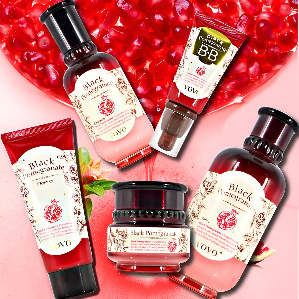 Six-piece pomegranate skincare set showing water, milk, cream, essence, eye cream and cleanser bottles