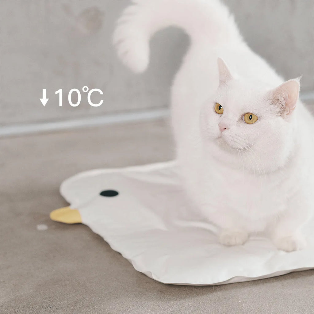 Washable chick-pattern pet cooling mat for dogs and cats on a floor