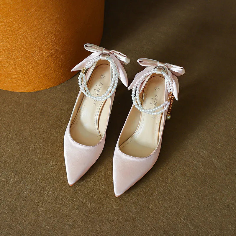 Stiletto pointed toe satin pumps with beaded pearl strap in Champagne colour