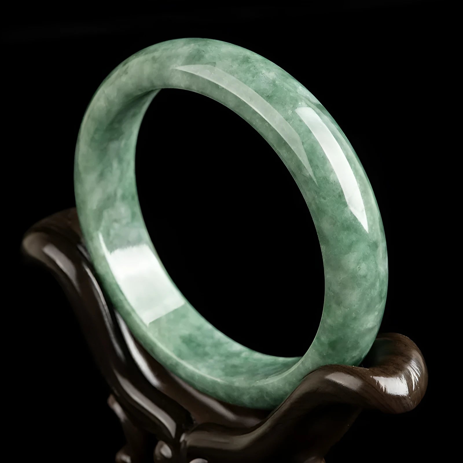 Natural emerald bean green jade beaded bracelet for women on a gift box.