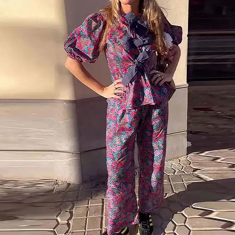 Women's floral print leisure suit set with tie-neck blouse and matching trousers