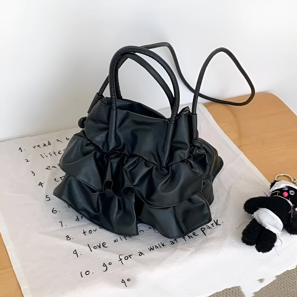 Ruffled bucket-style shoulder bag in Beige with open outer pocket and folding design