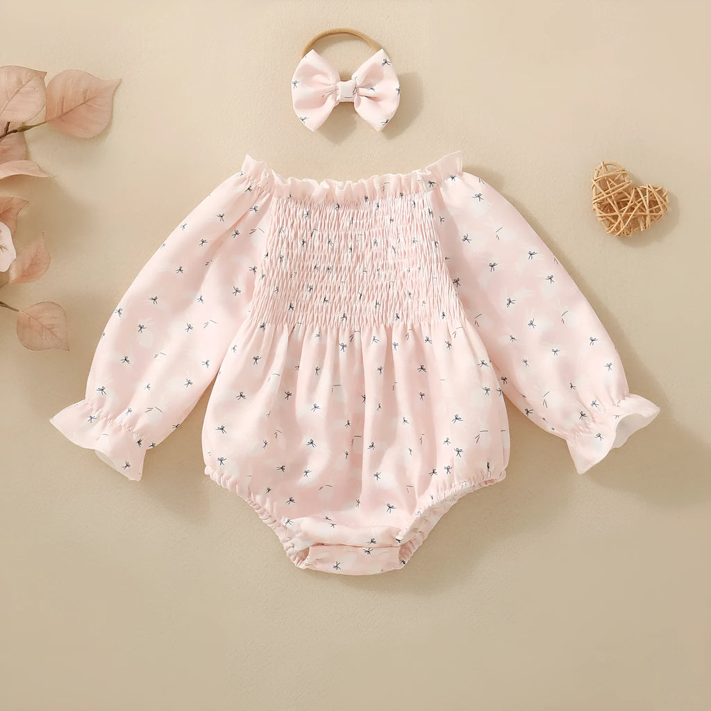 Pink infant cotton long sleeve romper with smocking and print on front for newborn baby girl