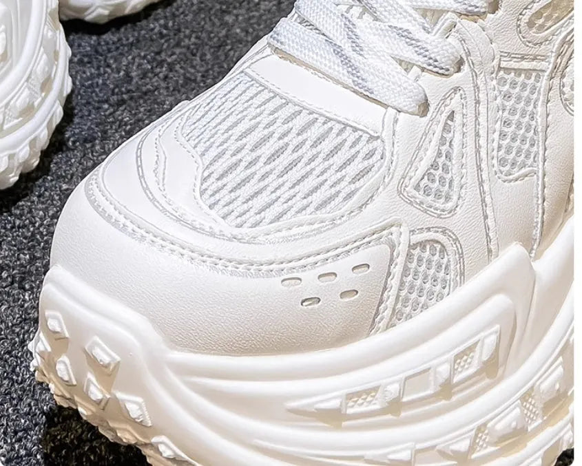 White women's dad shoes with lace-up closure showing round toe design and height increasing insole construction