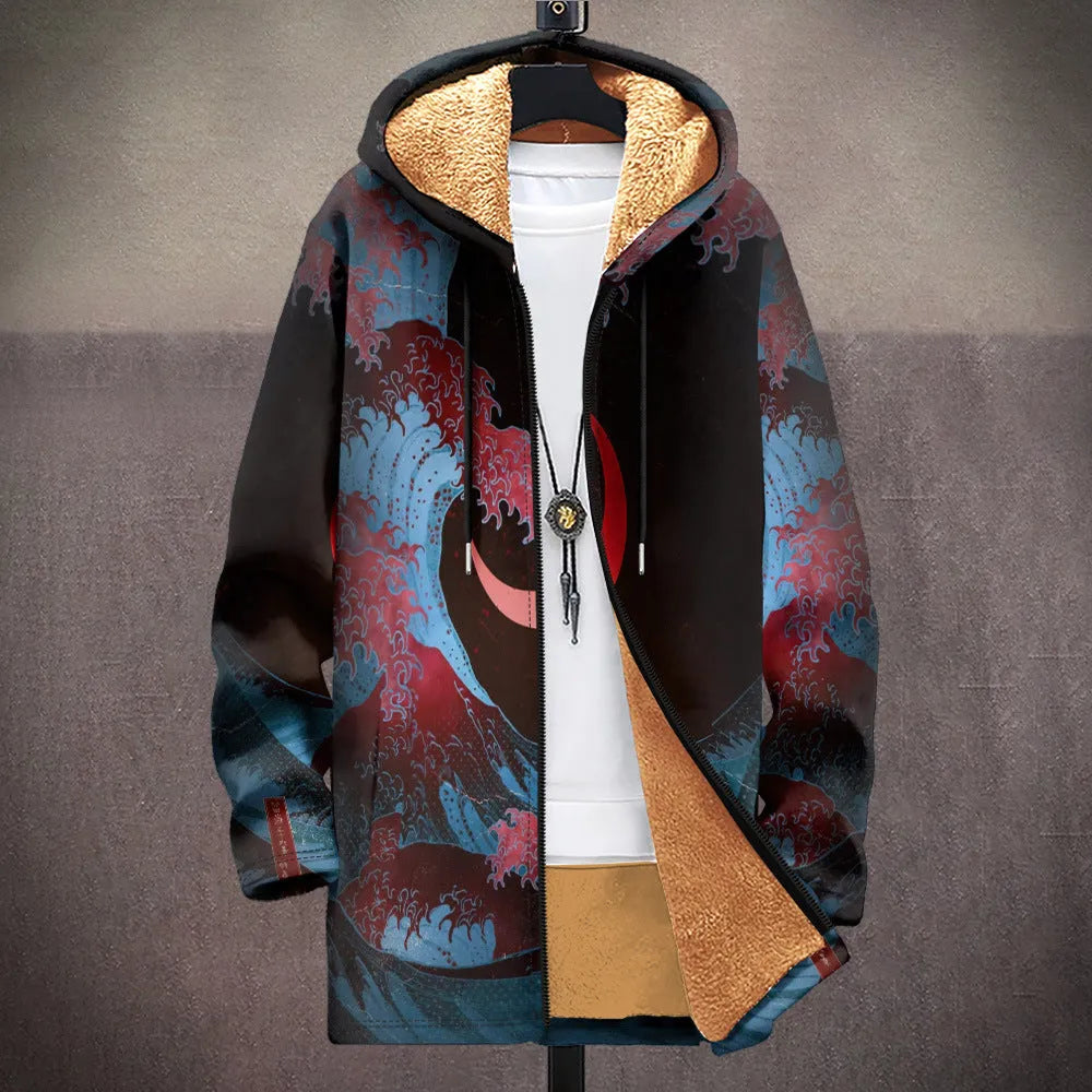 Man wearing a loose multicolour printed hooded cardigan with a front zip.
