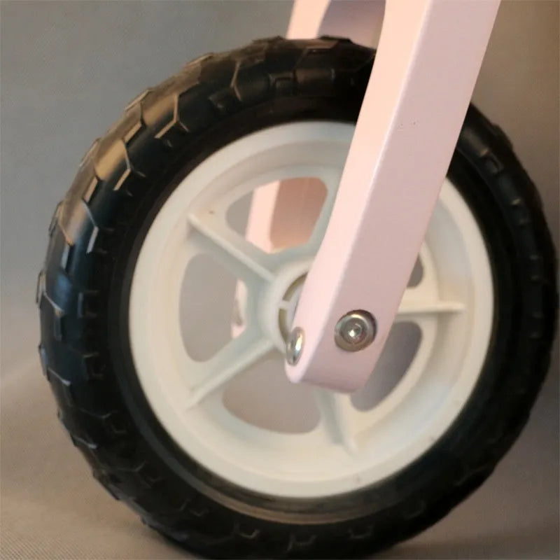 Pink wooden balance scooter for toddlers with 10 inch wheels