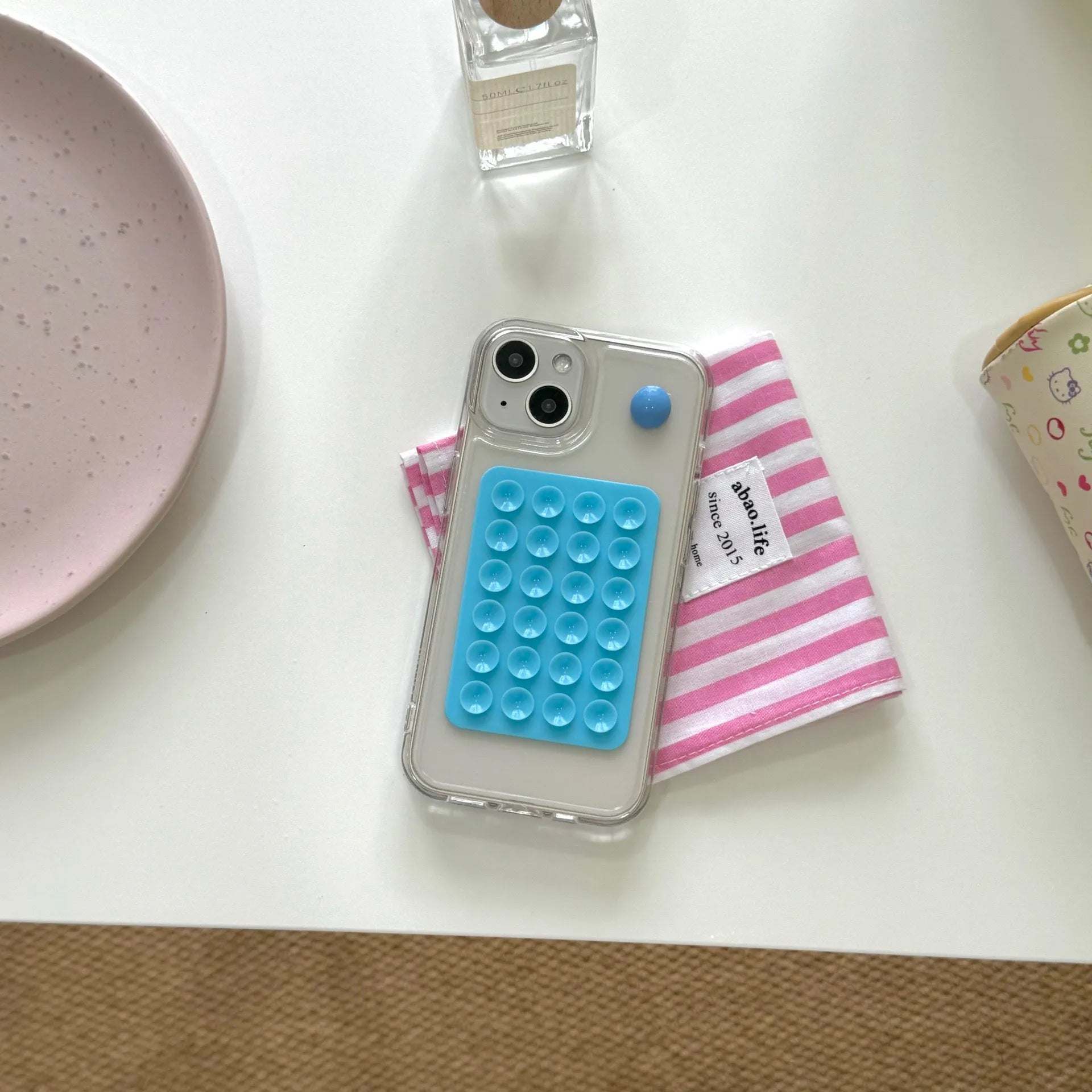 Silicone phone case with suction cup for iPhone 15 Pro Max in black showing back and edge coverage