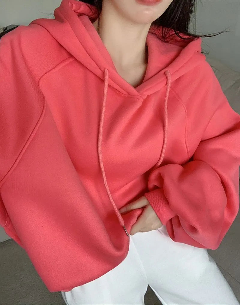Watermelon red mulberry silk sleeveless hooded sweater on hanger showing loose fit and hood detail