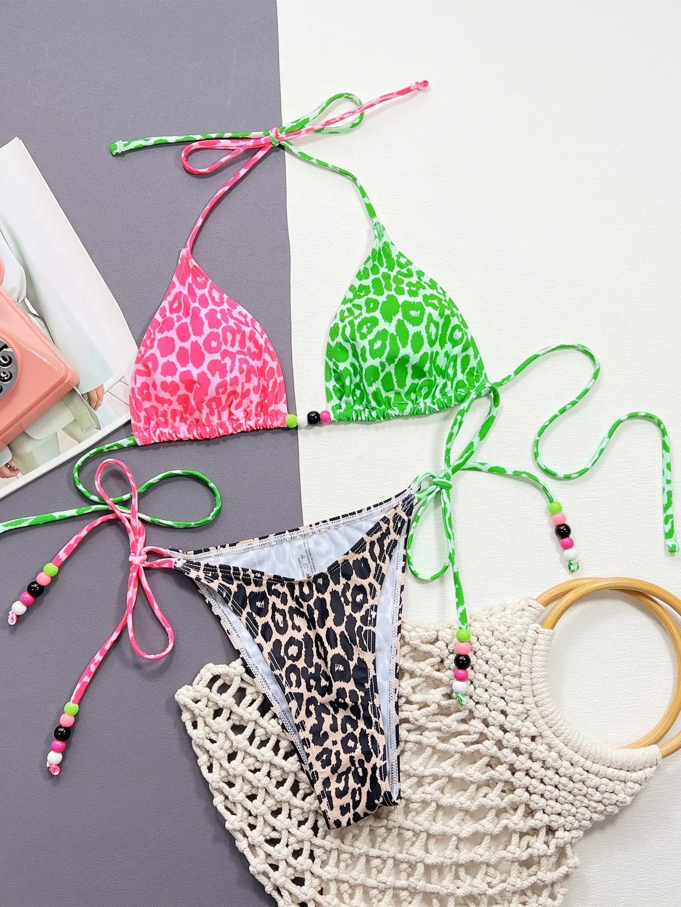 Women's leopard print bikini swimsuit set with bra and briefs on a white background.