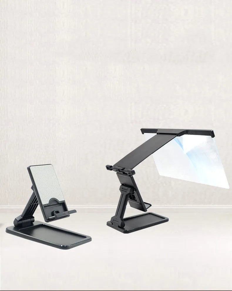 Black folding mobile phone screen magnifier with detachable holder next to an iPhone