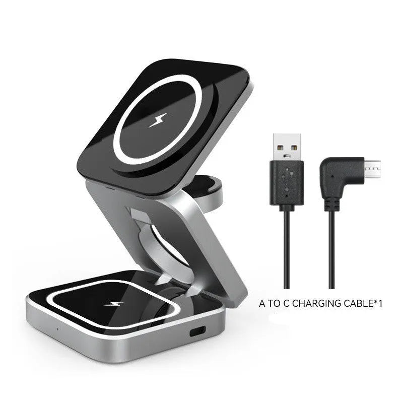 Three-in-one desktop wireless charging bracket unfolded on desk with iPhone, Samsung phone, and Google Pixel Watch positioned for charging