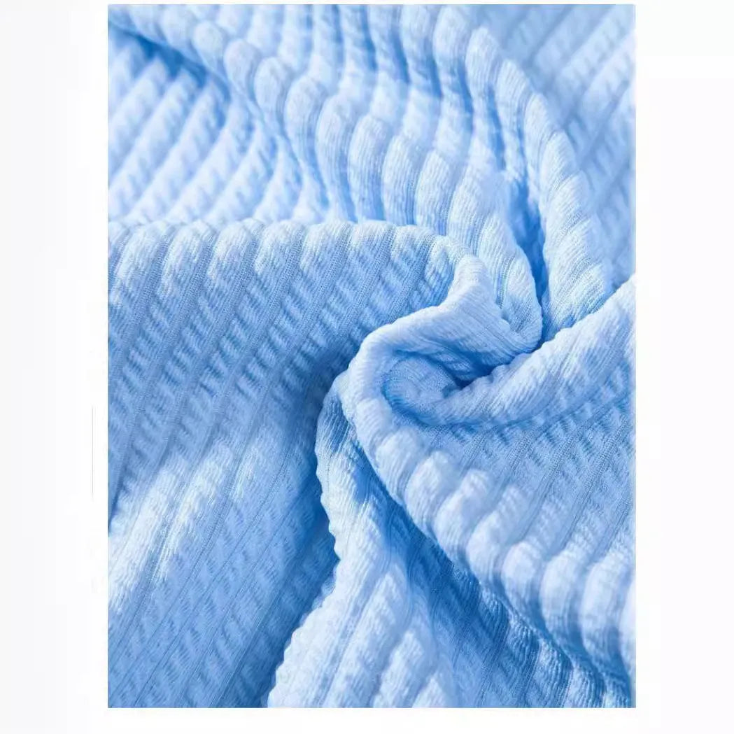 Men's loose-fitting short sleeve casual shirt in light blue polyester fabric.