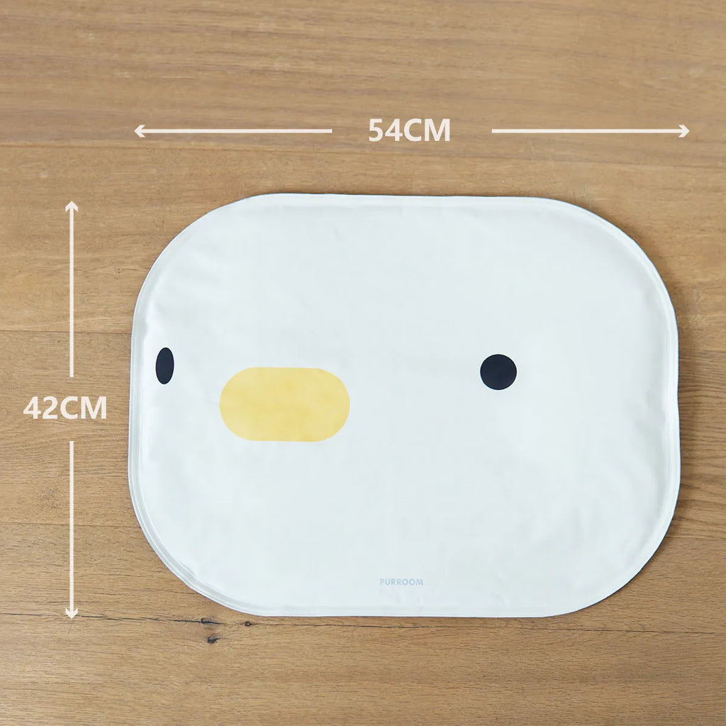 Washable chick-pattern pet cooling mat for dogs and cats on a floor