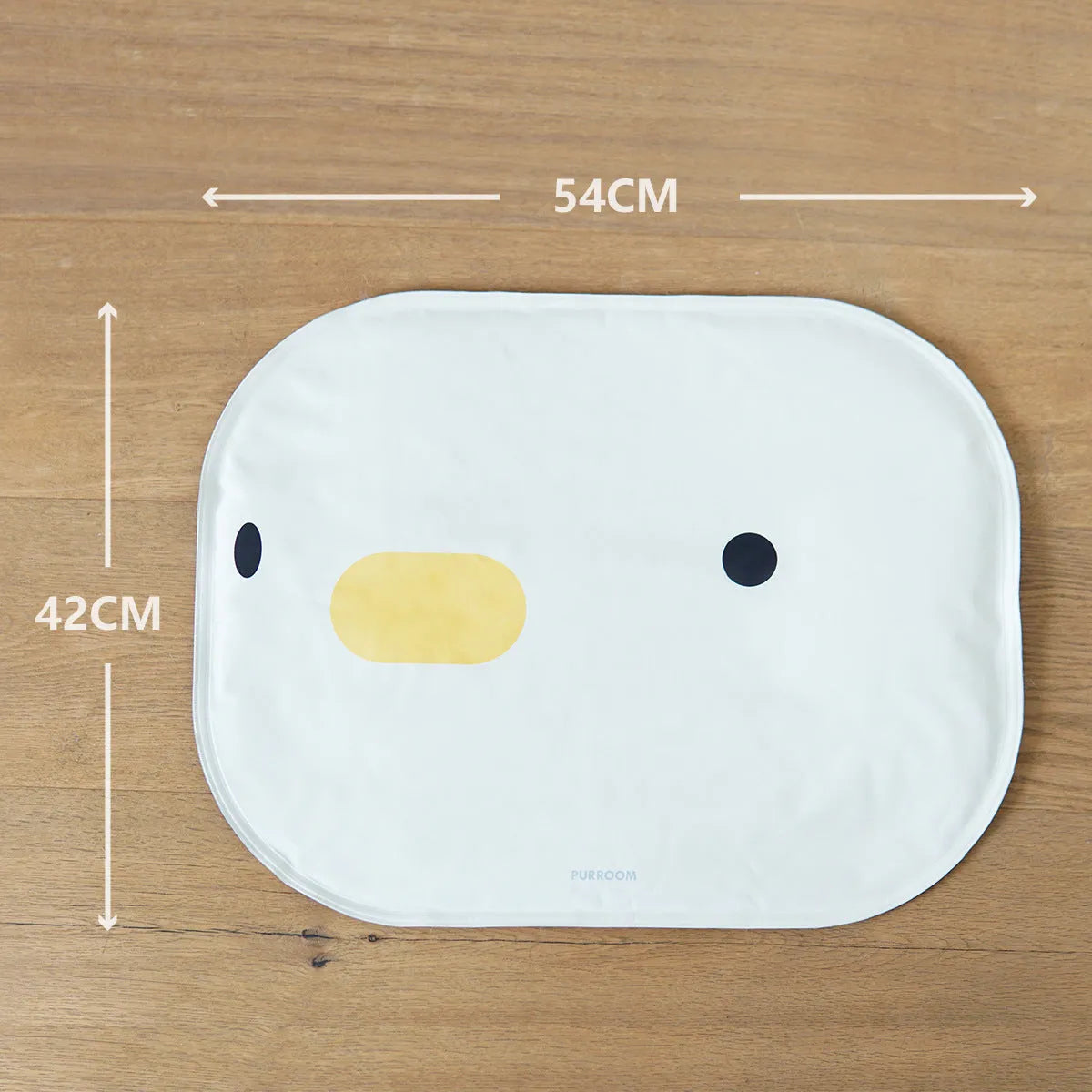 Washable chick-pattern pet cooling mat for dogs and cats on a floor