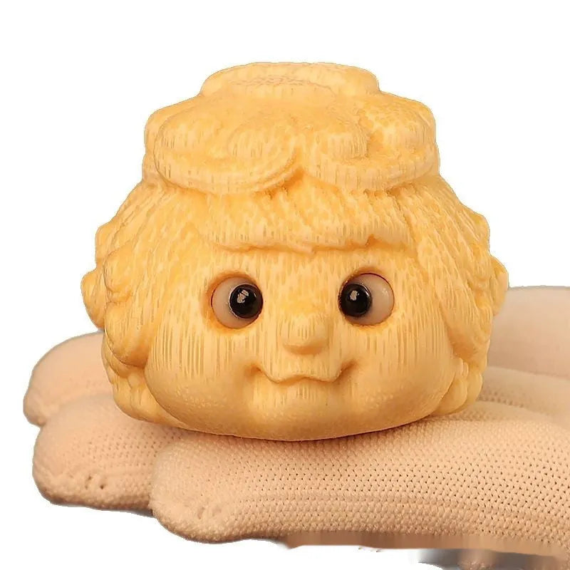 Solid bamboo carving of a cute Golden Toad Princess ornament on a neutral background.