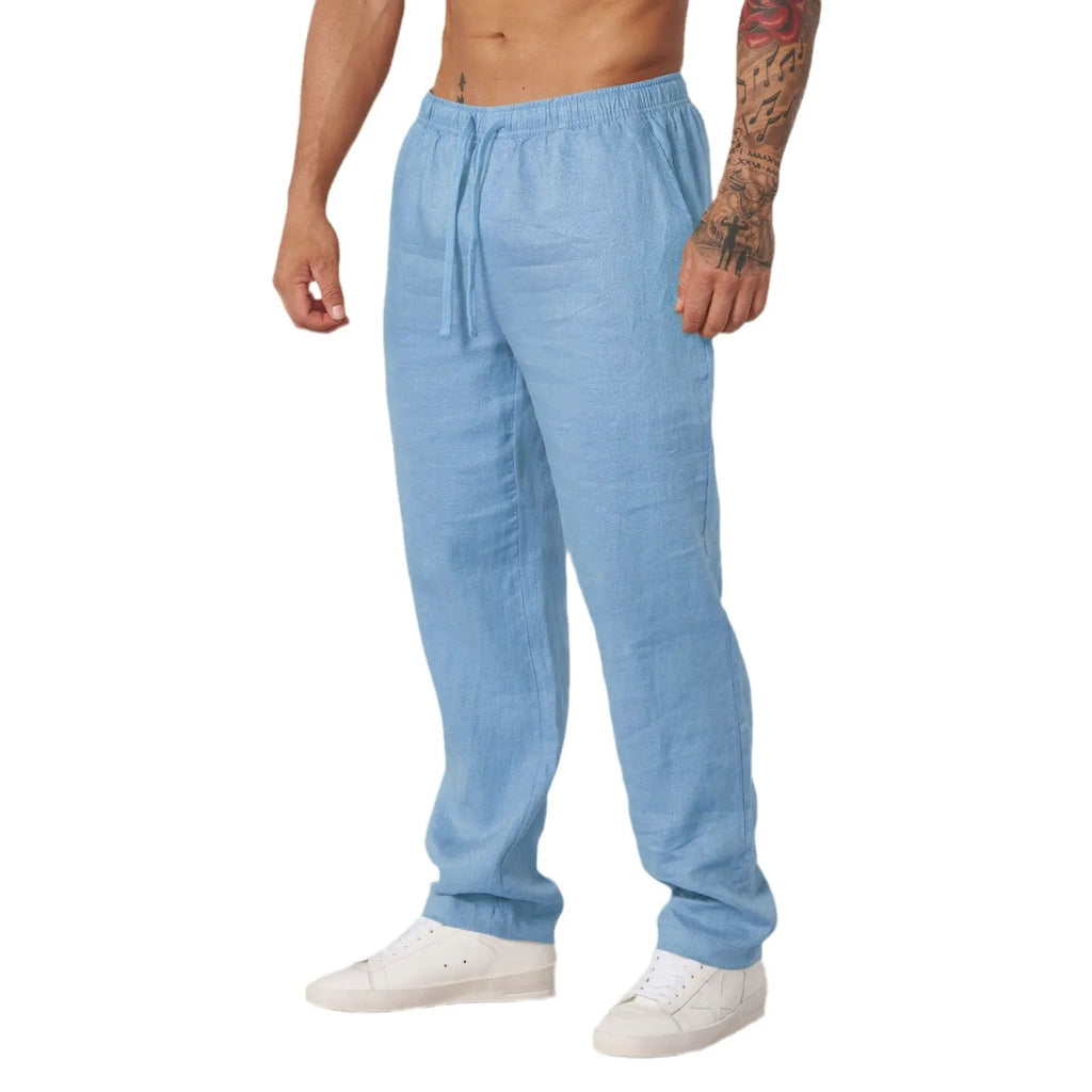 Men's casual sports trousers in polyester, available in white, black, khaki and sky blue, sizes S to XXL, no liner, regular length.